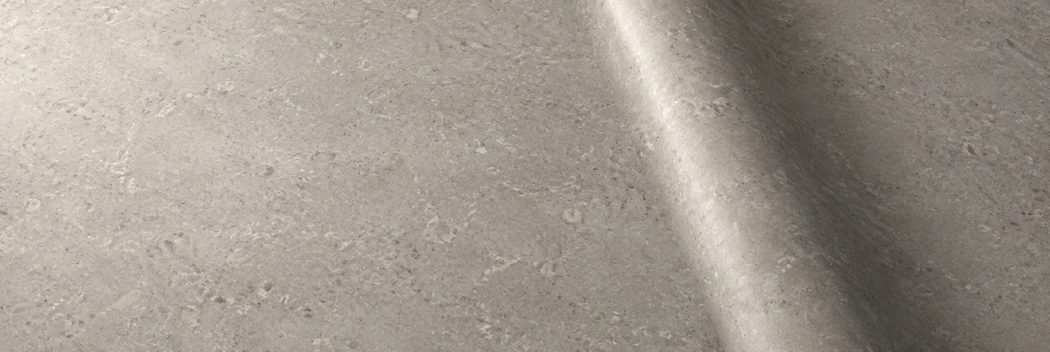 Limestone-effect architectural vinyl with a straight diagonal bend